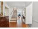 Elegant foyer with hardwood floors, staircase, and decorative furniture creating a welcoming atmosphere at 112 Waterfront Plantation Dr, Charleston, SC 29412
