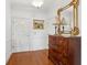 Grand foyer featuring hardwood floors, a decorative dresser, and ornate mirror creating a refined entrance at 112 Waterfront Plantation Dr, Charleston, SC 29412