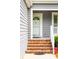 Inviting front entrance with brick steps and a classic white door, providing a warm welcome at 112 Waterfront Plantation Dr, Charleston, SC 29412
