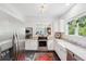 Bright kitchen featuring stainless steel appliances, white cabinetry, and a view into the dining area at 112 Waterfront Plantation Dr, Charleston, SC 29412