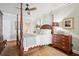 Elegant primary bedroom with four poster bed and plush carpet at 112 Waterfront Plantation Dr, Charleston, SC 29412