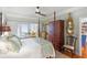 Spacious primary bedroom offering views of the lake at 112 Waterfront Plantation Dr, Charleston, SC 29412