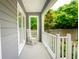 Cozy porch with a rocking chair, offering a relaxing outdoor space with scenic views at 112 Waterfront Plantation Dr, Charleston, SC 29412