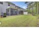 Well-maintained backyard featuring a screened-in porch at 113 Alpine Rd, Summerville, SC 29485