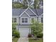 Charming townhouse features a one car garage, light gray siding and well-kept landscaping at 113 Alpine Rd, Summerville, SC 29485