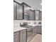 Modern kitchen with stainless steel appliances, gray cabinets, and quartz countertops at 113 Alpine Rd, Summerville, SC 29485