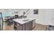 Open-concept kitchen with a center island, stainless steel appliances, and view to the dining and living areas at 113 Alpine Rd, Summerville, SC 29485