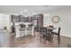 Open-concept kitchen features an island, stainless appliances and adjacent dining area at 113 Alpine Rd, Summerville, SC 29485