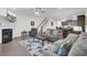 Open-concept living room showcasing a fireplace and stairs to the second floor at 113 Alpine Rd, Summerville, SC 29485