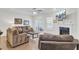 Inviting living room with fireplace, ceiling fan, and sliding door to the patio at 113 Alpine Rd, Summerville, SC 29485