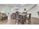 Open-concept living room and dining area featuring hardwood floors and natural light at 113 Alpine Rd, Summerville, SC 29485