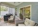 Relaxing screened in porch with outdoor seating, providing the perfect outdoor oasis at 113 Alpine Rd, Summerville, SC 29485