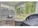 Screened porch with outdoor seating and ceiling fan at 113 Alpine Rd, Summerville, SC 29485