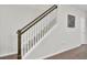 Staircase with white railings and wood accents leading to the upper level at 113 Alpine Rd, Summerville, SC 29485