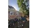 Exterior view of a brick house with windows, an AC unit, and flower pots in the backyard at 1138 Landsdowne Dr, Charleston, SC 29412