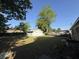 Lawn view of the garage nestled within a spacious, grassy, fenced in backyard at 1138 Landsdowne Dr, Charleston, SC 29412