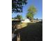 A spacious backyard featuring a white two-car garage and a fenced perimeter for privacy at 1138 Landsdowne Dr, Charleston, SC 29412