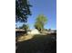 View of the garage nestled within a spacious, grassy, fenced in backyard at 1138 Landsdowne Dr, Charleston, SC 29412