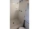 Shower stall showcasing white tiled walls and flooring next to updated white vanity at 1138 Landsdowne Dr, Charleston, SC 29412