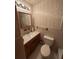 Bathroom with a single sink vanity, floral wallpaper and ceramic tile flooring at 1138 Landsdowne Dr, Charleston, SC 29412