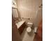 Bathroom with a single sink vanity, floral wallpaper and ceramic tile flooring at 1138 Landsdowne Dr, Charleston, SC 29412