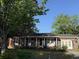 Charming brick home with mature trees and covered front entry at 1138 Landsdowne Dr, Charleston, SC 29412