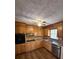 Cozy kitchen with wood cabinets, stainless steel appliances, and ceiling fan at 1138 Landsdowne Dr, Charleston, SC 29412