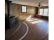 Living room featuring brick fireplace, wood paneling, and custom shelving at 1138 Landsdowne Dr, Charleston, SC 29412