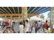 Community gathering space under the highway with bustling market and a lively social atmosphere at 1153 King St, Charleston, SC 29403