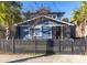 Charming two-story home with a fenced-in yard and mature landscaping at 1153 King St, Charleston, SC 29403