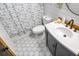 Bathroom featuring dark vanity with white sink, dark faucet, and tile floors at 1192 Church Of God Rd, Bonneau, SC 29431