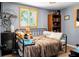 Charming bedroom with hardwood floors, good light, and built-in shelving unit at 1192 Church Of God Rd, Bonneau, SC 29431
