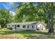 Classic single-story home featuring a well-maintained lawn and large, mature trees at 1192 Church Of God Rd, Bonneau, SC 29431