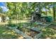 Multiple raised beds and trellises adorn the backyard of this lovely home at 1192 Church Of God Rd, Bonneau, SC 29431