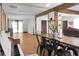 Bright and open living room with exposed beams, hardwood floors, and dining area at 1192 Church Of God Rd, Bonneau, SC 29431