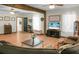 Open living room featuring hardwood floors and comfortable, oversized sectional sofa with multiple windows at 1192 Church Of God Rd, Bonneau, SC 29431