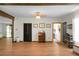 Spacious living room featuring hardwood floors, light-filled rooms, and exposed wood beam accents at 1192 Church Of God Rd, Bonneau, SC 29431