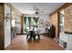 Inviting living room featuring hardwood floors, brick accent wall, and elegant décor at 1192 Church Of God Rd, Bonneau, SC 29431
