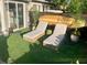 Inviting backyard patio with two lounge chairs, surfboards, and lush greenery, perfect for relaxing at 1202 Ventura Pl, Mount Pleasant, SC 29464