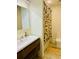 Modern bathroom with wood vanity, decorative shower curtain, and playful peach bathmat at 1202 Ventura Pl, Mount Pleasant, SC 29464