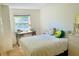 Bright bedroom features a large window, white walls, and a comfy bed with plush pillows at 1202 Ventura Pl, Mount Pleasant, SC 29464