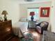 Bright bedroom features hardwood floors, neutral decor, and ample natural light at 1202 Ventura Pl, Mount Pleasant, SC 29464