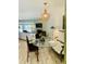 Open-concept dining area with an acrylic table and a view into the living room at 1202 Ventura Pl, Mount Pleasant, SC 29464