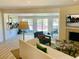 Bright and airy living room with a fireplace, comfortable seating, and views of the yard at 1202 Ventura Pl, Mount Pleasant, SC 29464