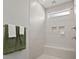 Modern bathroom shower with a built-in bench, niche shelving, and sleek, neutral tiling at 1206 Homecoming Blvd, Ravenel, SC 29470