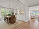 Inviting dining room featuring a chandelier, natural light, and seamlessly connected to the living area at 1206 Homecoming Blvd, Ravenel, SC 29470