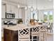 Modern kitchen featuring a large island, pendant lighting, stainless steel appliances and an eat-in dining area at 1206 Homecoming Blvd, Ravenel, SC 29470
