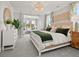 Serene main bedroom with soft lighting, a king bed, and view into a sitting room at 1206 Homecoming Blvd, Ravenel, SC 29470