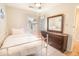 Bright bedroom with a white iron bed frame, natural light, and a dark wooden dresser at 1230 Hawthorne Cir, Hanahan, SC 29410