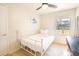 Bright bedroom with a white bed frame, natural light, and a ceiling fan at 1230 Hawthorne Cir, Hanahan, SC 29410